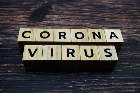 Corona Virrus word alphabet letter on wooden backgroundの写真素材