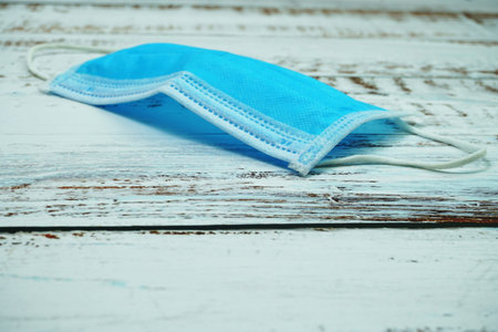 Medical Mask on wooden backgroundの写真素材