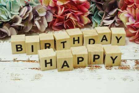 Happy Birthday alphabet letter on wooden backgroundの写真素材