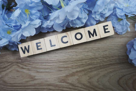 Welcome alphabet letter with space copy on wooden backgroundの写真素材