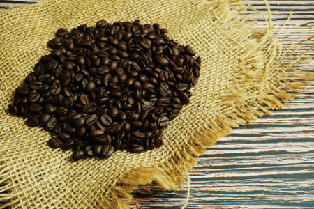 Roasted Coffee Beans on wooden background