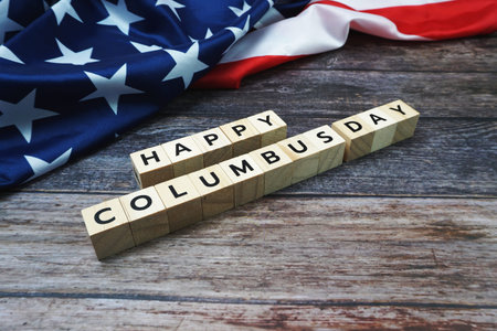 Happy Columbus day Word alphabet letters with USA flag on wooden background