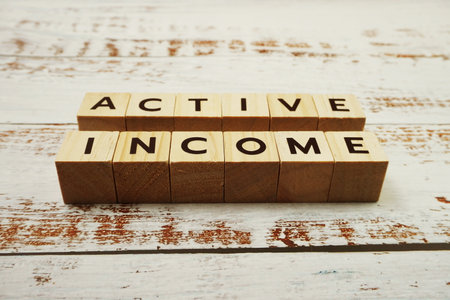 Active Income Word alphabet letters on wooden backgroundの写真素材