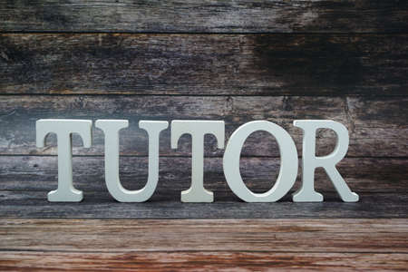 Tutor Word alphabet letters on wooden backgroundの写真素材