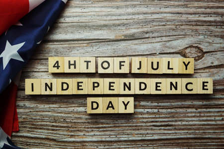 Fourth of July Independence Day alphabet letter on wooden backgroundの写真素材