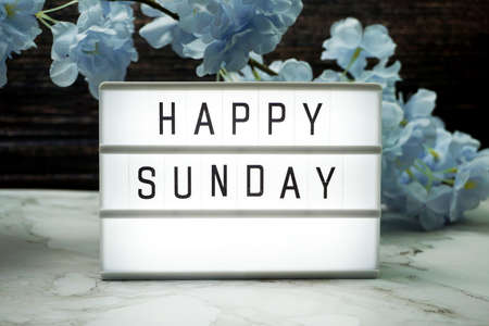 Happy Sunday word in light box with Flowers Decorationの写真素材
