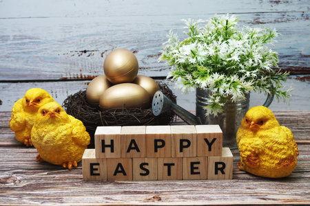 Happy Easter with rabbit and easter eggs decoration on wooden background