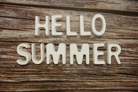 Hello Summer text message on wooden backgroundの写真素材