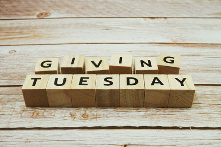 Giving Tuesday alphabet letter on wooden backgroundの写真素材
