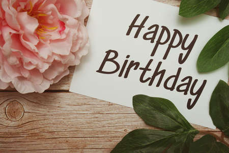 Happy Birthday typography text on wooden backgroundの写真素材