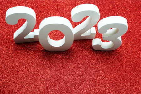 2023 Happy New Year with space copy on red glitter backgroundの写真素材