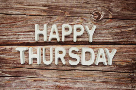 Happy Thursday text message on wooden backgroundの写真素材