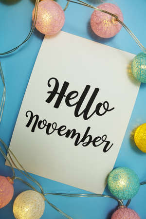Hello November typography text with LED cotton ball on blue backgroundの写真素材