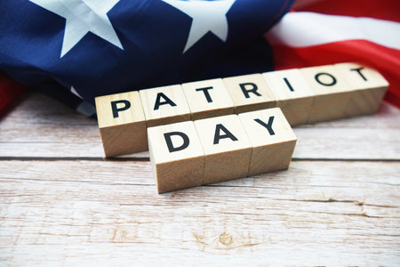 Patriot Day alphabet letter and American flag on wooden backgroundの写真素材