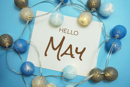 Hello May typography text with LED cotton ball on blue backgroundの写真素材