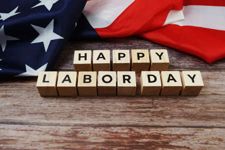Happy Labor Day Word alphabet letters with USA flag on wooden backgroundの写真素材