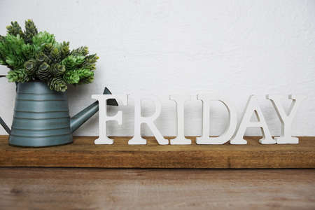 Friday alphabet letters on wooden backgroundの写真素材