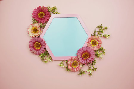 Blue Hexagon background and pink border decorate with flowers on pink background