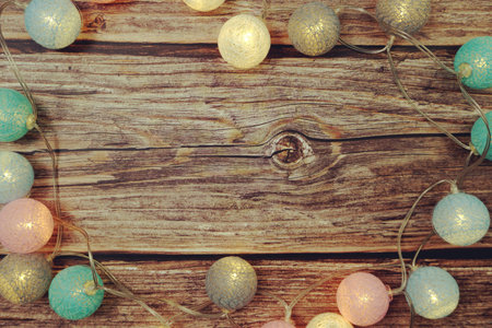 Colorful LED cotton ball decorative on woode background