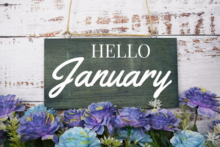Happy January typography text decorate with flower on wooden backgroundの写真素材