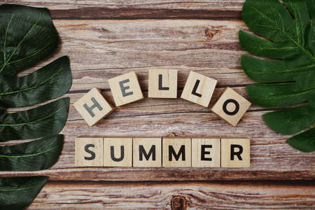 Hello Summer message alphabet letter on wooden backgroundの写真素材