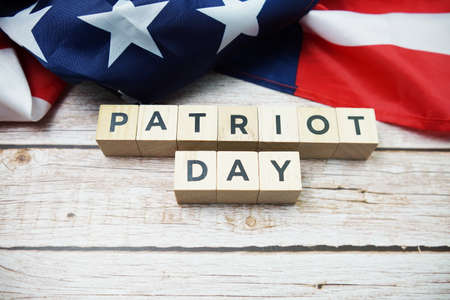 Patriot Day alphabet letter and American flag on wooden backgroundの写真素材