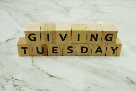 Giving Tuesday alphabet letter on marble backgroundの写真素材