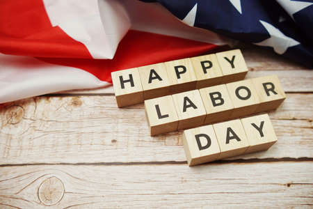 Happy Labor Day alphabet letter and American flag on wooden backgroundの写真素材