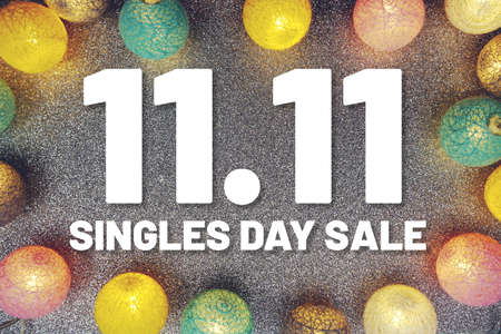 11.11 Singles Day Sale text and LED cotton Balls Decoration on silver Glitter backgroundの写真素材
