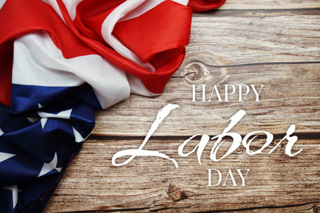Happy Labor Day alphabet letter and American flag on wooden background