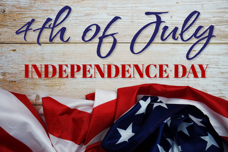 4th Of July Independence Day message with American flag on wooden background