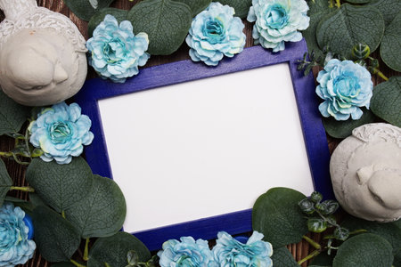 Empty space for copy with flower and eucalyptus leaves decoration on wooden backgroundの写真素材