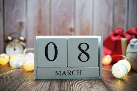 Wooden calendar March 08 on wooden backgroundの写真素材