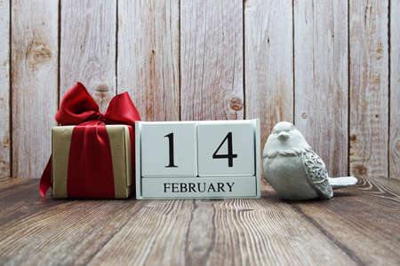 Wooden calendar February 14 on wooden backgroundの写真素材