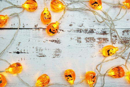 Pumpkin Lights LED for Halloween Decorations on wooden background