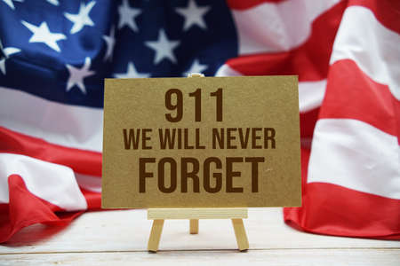 911 We will Never Forget  Word with USA flag on wooden backgroundの写真素材