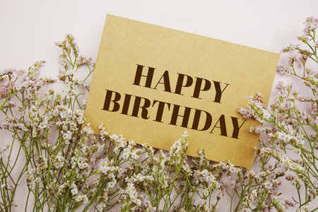 Happy Birthday text message with flower decoration blue backgroundの写真素材