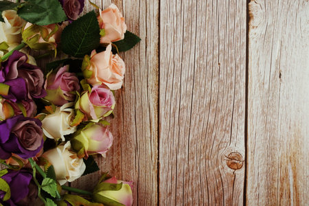 Roses flower bouquet with space copy on wooden backgroundの写真素材
