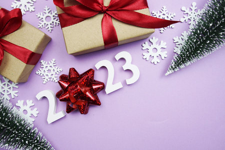 Happy New Year 2023 alphabet letters on purple background
