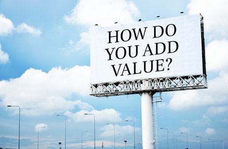 How do you add value? text message on signboard with blue skyの写真素材