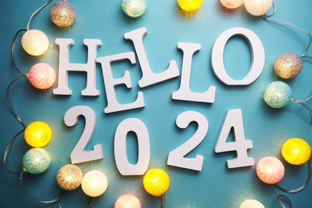 Hello 2024 alphabet letter with cotton ball LED decoration on blue backgroundの写真素材