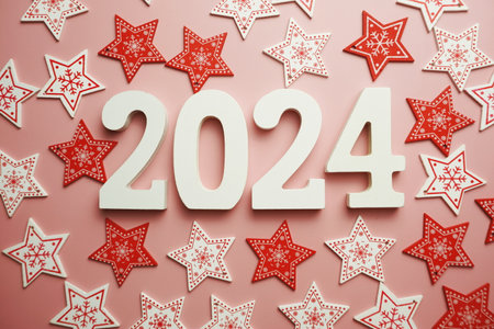 Happy New Year 2024 alphabet letter with Christmas decoration on pink backgroundの写真素材