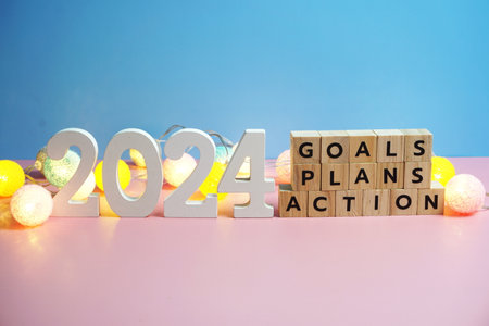 2024 new year goals, plan, action alphabet letters on blue and pink backgroundの写真素材