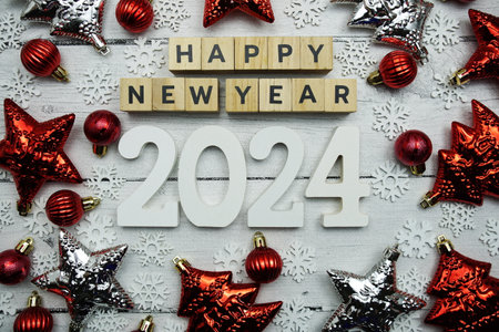 Happy New Year 2024 alphabet letters and christmas decoration on wooden backgroundの写真素材