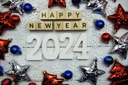 Happy New Year 2024 alphabet letters and christmas decoration on wooden backgroundの写真素材