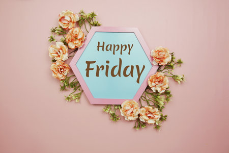Happy Friday typography text decorate with flower on pink backgroundの写真素材