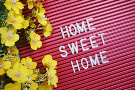 Home Sweet Home text on Letter Board with flower decoration
