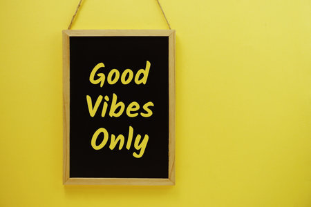 Good Vibes Only typography text on blackboard hanging against on the wall backgroundの写真素材