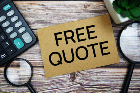 Free Quote text message with calculator and magnifying top view on wooden background