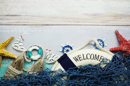 Nautical and summer background top view on wooden backgroundの写真素材
